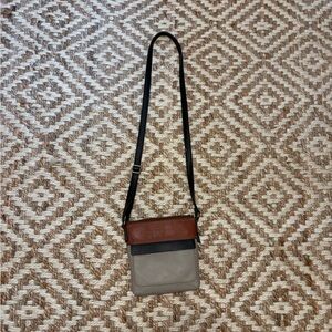 Fossil Cross Body purse , Black, Gray, and Brown colored.